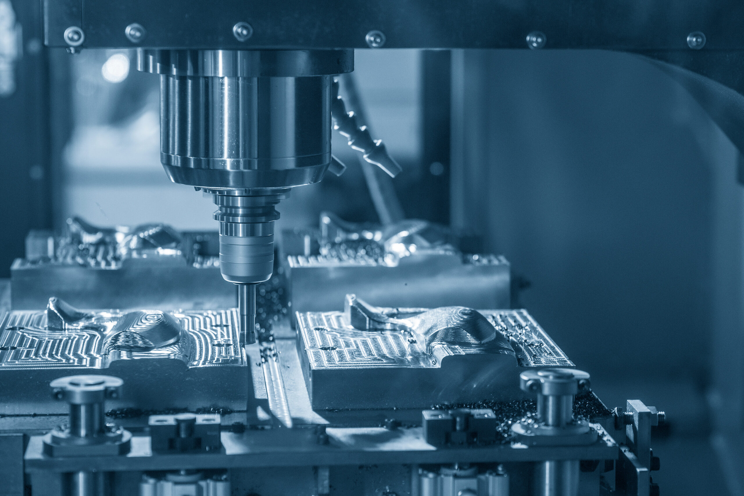 The CNC milling machine rough cutting the mould part by index-ab